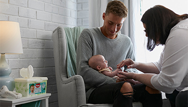 Bub with dad and Midwife Cath